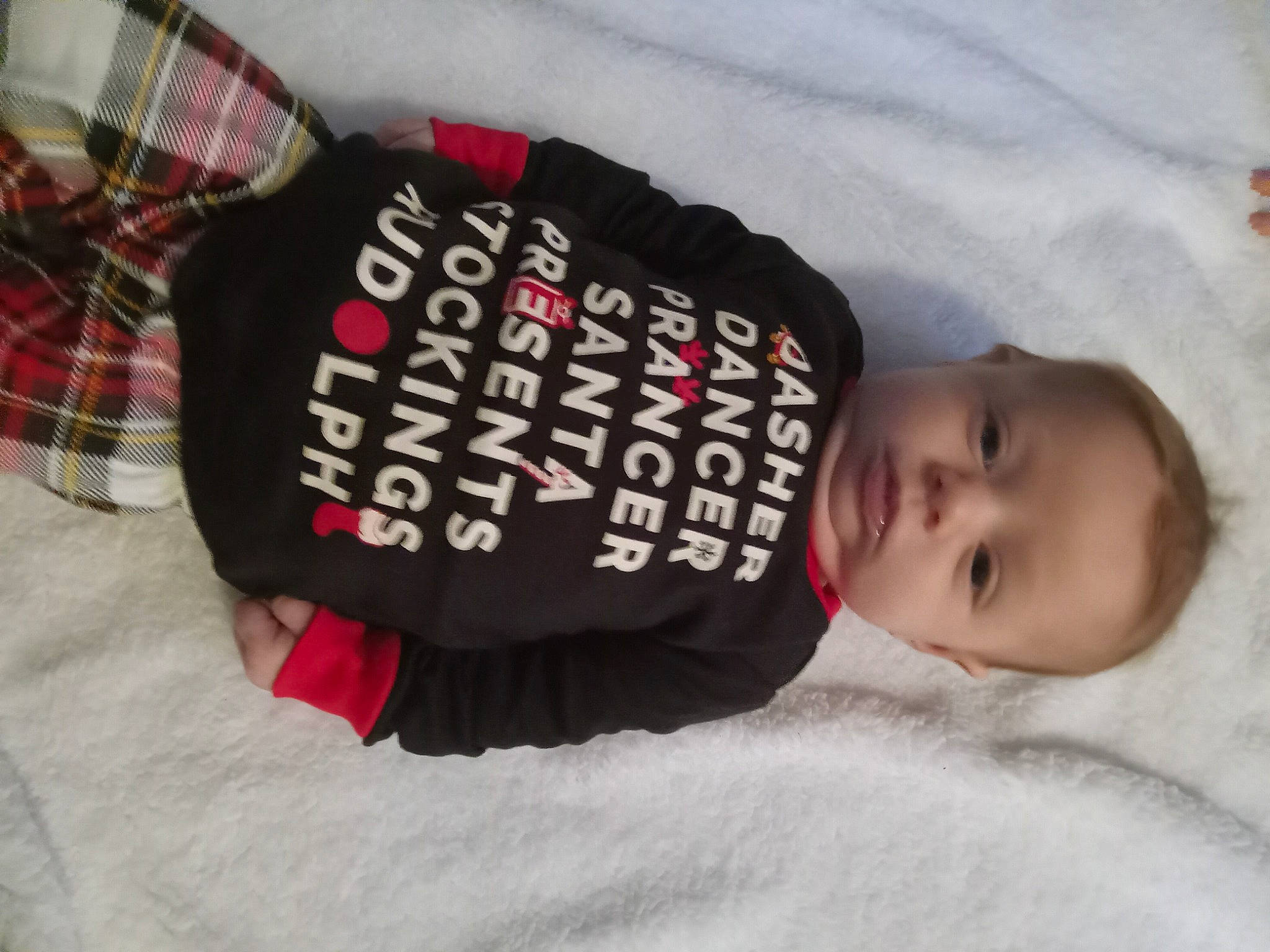 Delilah is registered to the contest to win money with this photo: baby, baby_products, baby_sleeping, baby_toddler_clothing, carmine, child, comfort, font, fur, linens, mammal, pattern, person, plaid, room, sleeve, tartan, textile, toddler, vertebrate