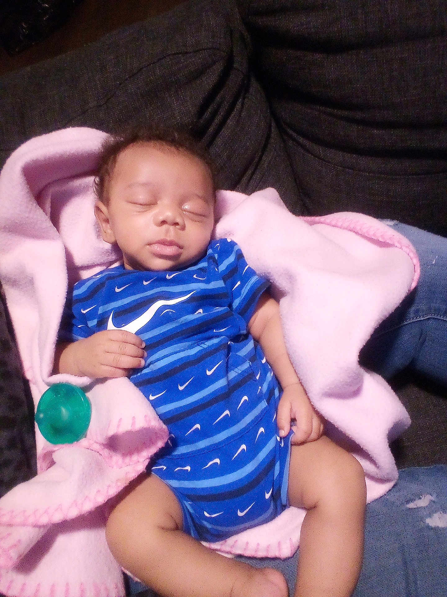 Emil is registered to the contest to win money with this photo: baby, infant, sleeping, blanket, pink_blanket, pacifier, onesie, blue_stripes, couch, sofa, living_room, newborn, cozy, peaceful, closed_eyes, hand, legs, denim, fabric, portrait