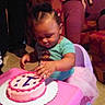 Embher Marie Hunt is registered to the contest to win money with this photo: adult, baby, birthday_cake, cake, celebration, chair, child, clothing, family, food, fun, indoor, living_room, party, person, pink, smile, table, toddler, tutu