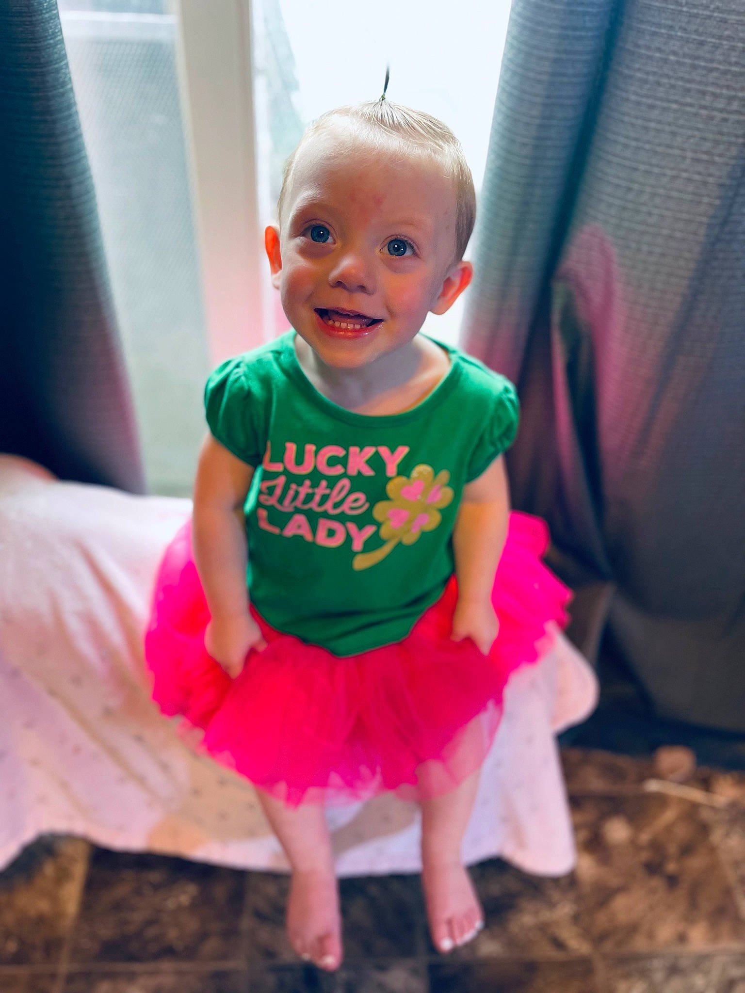 Everley joined the competition — help win amazing prizes! baby, baby_toddler_clothing, child, day_dress, dress, eye, fun, grass, happy, iris, joy, magenta, pattern, person, pink, purple, sitting, skin, sleeve, smile