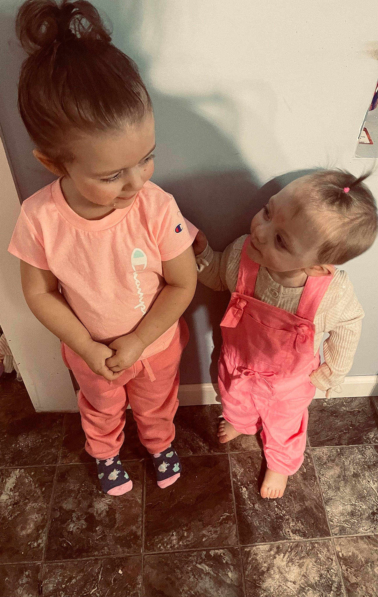 Everley is registered to the contest to win money with this photo: baby, baby_toddler_clothing, cheek, child, dress, flooring, fun, gesture, grass, hair, happy, human_body, nose, person, pink, shoe, skin, sleeve, smile, standing