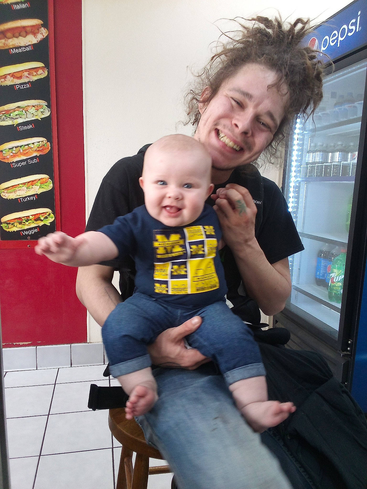 Cora joined the competition — help win amazing prizes! baby, baby_toddler_clothing, chair, child, denim, event, fun, happy, jeans, joy, lap, leisure, muscle, person, room, shorts, sitting, smile, t_shirt, toddler