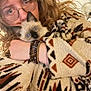 blanket, blue_eyes, bracelets, cat, close_up, cozy, curly_hair, cute, fabric_pattern, fur, glasses, hand, holding, indoor, kitten, person, pet, portrait, siamese_cat, sweater