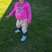 Elizabeth joined the competition — help win amazing prizes! child, toddler, grass, outdoor, pacifier, pink_shirt, boots, curly_hair, backyard, sunlight, pants, standing, fence, table, play_area, casual_clothing, baby, cute, exploring, daytime