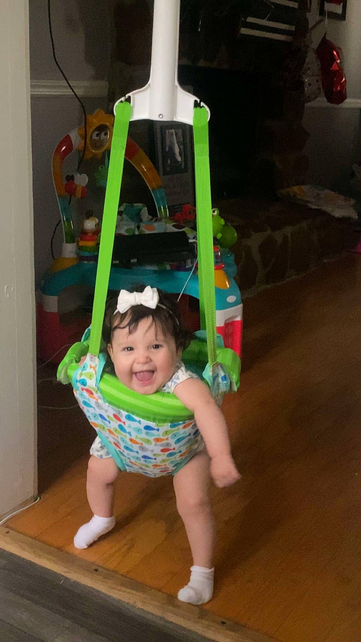 Macie joined the competition — help win amazing prizes! baby_toddler_clothing, child, flooring, fun, green, happy, hardwood, headwear, human_leg, joy, leisure, party_supply, pattern, person, play, room, shorts, smile, sock, t_shirt