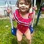 child, toddler, swing, smiling, red_swimsuit, outdoor, grass, playground, happy, summer, barefoot, wet_hair, person, fun, daylight, recreation, backyard, cute, young, portrait