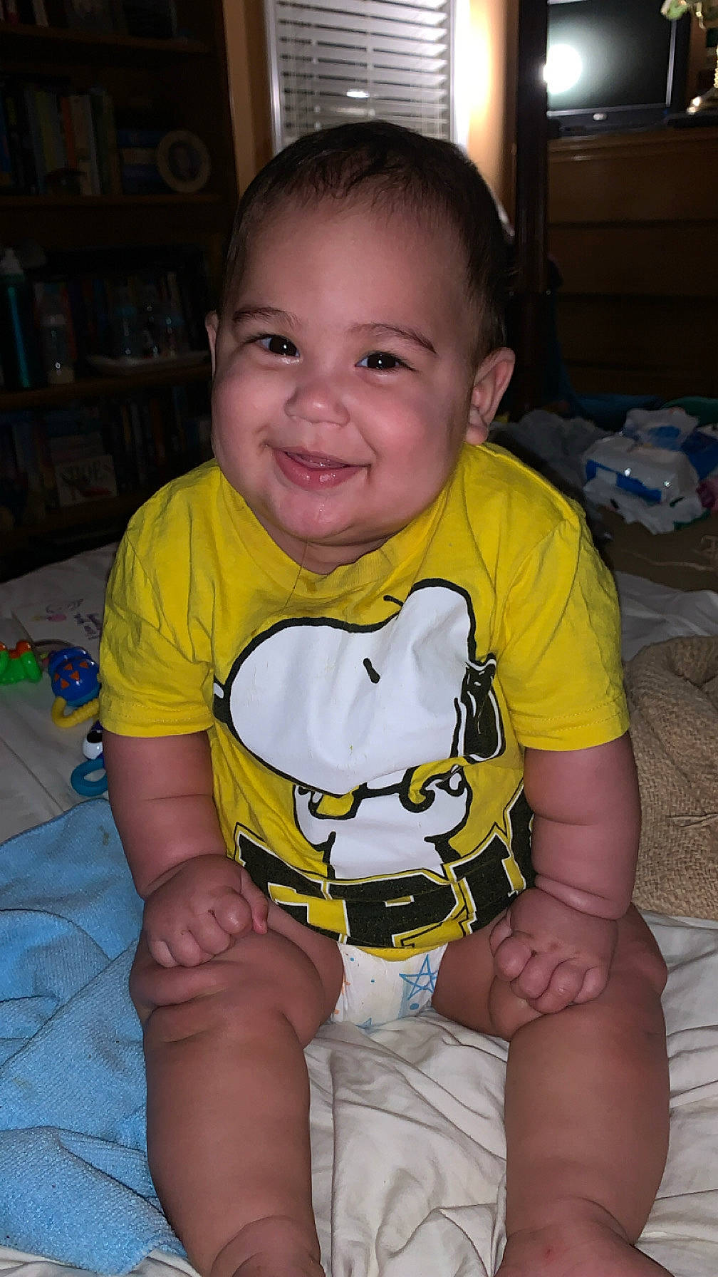 Andrew is registered to the contest to win money with this photo: baby, bodypart, clothing, computerhardware, couch, electronics, face, finger, furniture, hand, hardware, head, indoors, monitor, person, photography, portrait, screen, shelf, t_shirt