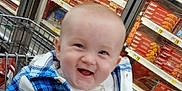 Michael joined the competition — help win amazing prizes! baby, child, shopping_cart, supermarket, smiling, plaid_jacket, blue, white, aisle, food_packages, cookies, grocery_store, happy, infant, clothing, indoor, retail, toddler, cute, person