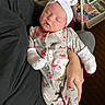 Riley joined the competition — help win amazing prizes! baby, sleeping, onesie, headband, bow, hand, adult, couch, blanket, footwear, sock, infant, child, indoor, clothing, person, resting, cute, soft, home