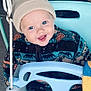 toddler, child, smiling, blue_eyes, hat, knit_hat, jacket, patterned_jacket, swing, playground, outdoor, happy, cute, baby, seat, rope, winter_clothing, fun, portrait, person