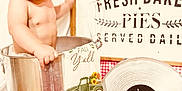 Kallen joined the competition — help win amazing prizes! baby, child, cute, decor, gingham, indoor, kitchen, metal_bucket, milestone, nine_months, pie_tin, playful, portrait, props, red_background, sign, smiling, sunflowers, towel, vintage_truck