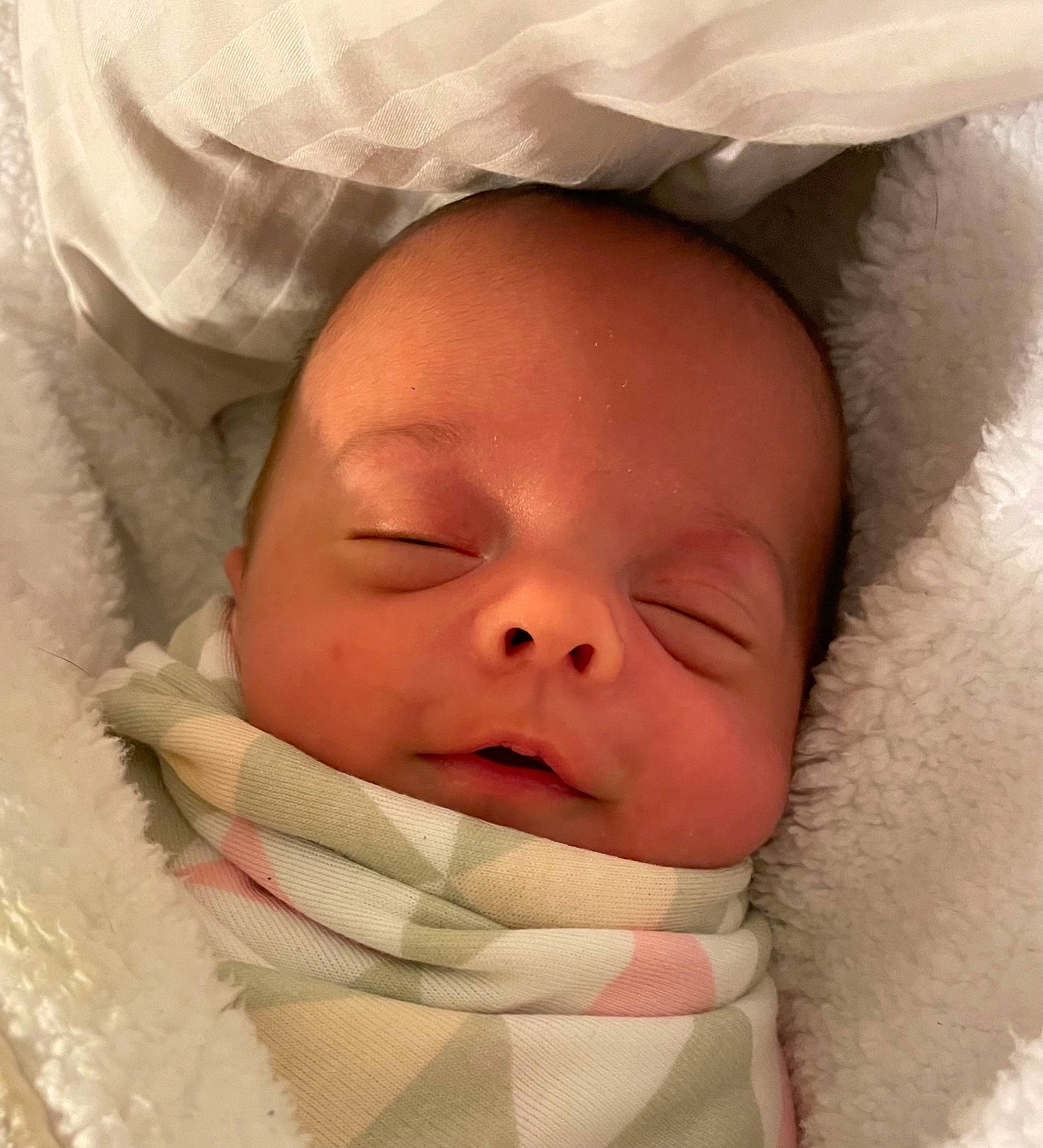 Katrina is registered to the contest to win money with this photo: baby, blanket, face, head, newborn, person, photography, portrait, sleeping