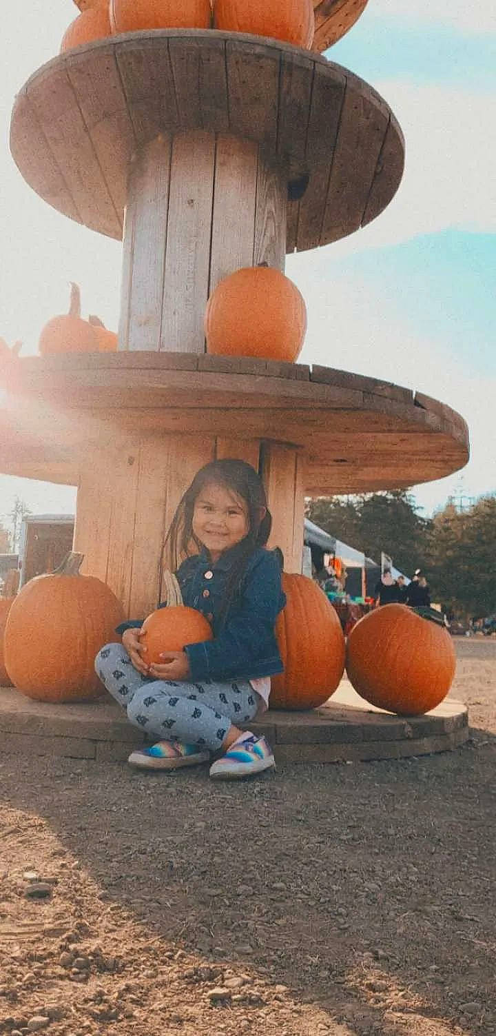 Jhenè is registered to the contest to win money with this photo: calabaza, child, cucurbita, fun, gourd, joy, leisure, people, person, photograph, plant, pumpkin, sitting, sky, smile, squash, toddler, tree, vegetable, window
