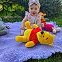 Izabella joined the competition — help win amazing prizes! baby, child, outdoor, grass, blanket, plush_toy, winnie_the_pooh, tigger, piglet, headband, smiling, happy, greenery, garden, sunlight, cute, playtime, purple_blanket, dress, summer