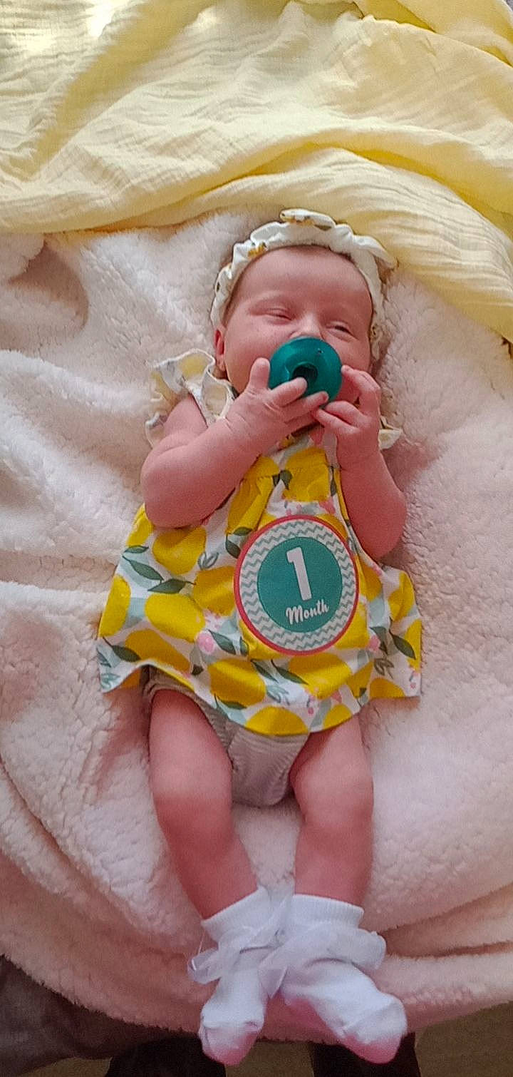 Elizabeth joined the competition — help win amazing prizes! baby, baby_products, baby_safety, baby_sleeping, baby_toddler_clothing, baby_toys, child, comfort, face, finger, fun, happy, linens, pattern, peach, person, pink, skin, sleeve, thumb