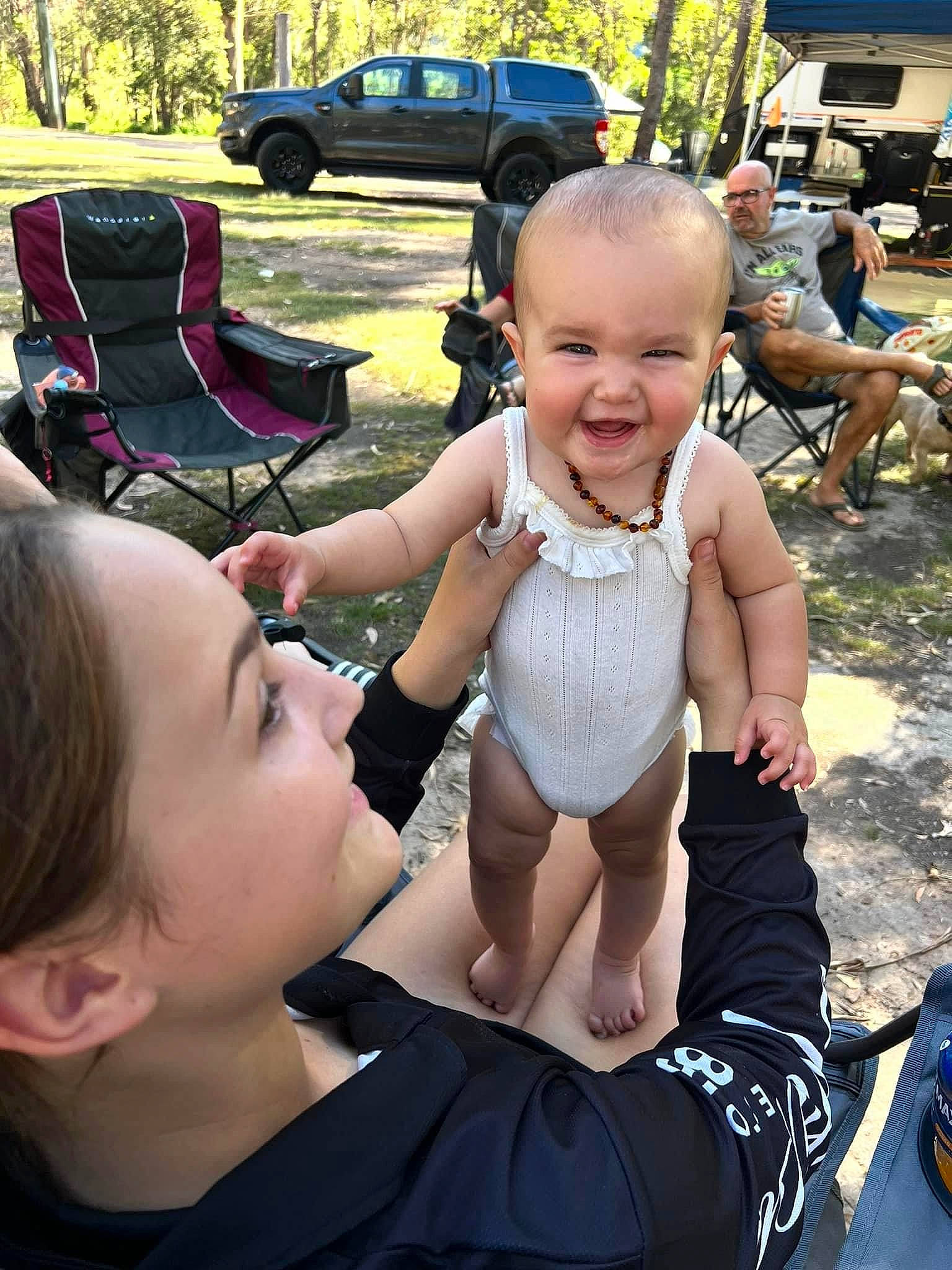 Haizel is registered to the contest to win money with this photo: baby, car, child, event, fun, grass, hairstyle, happy, joy, leisure, person, plant, recreation, shorts, smile, summer, tire, toddler, tree, truck