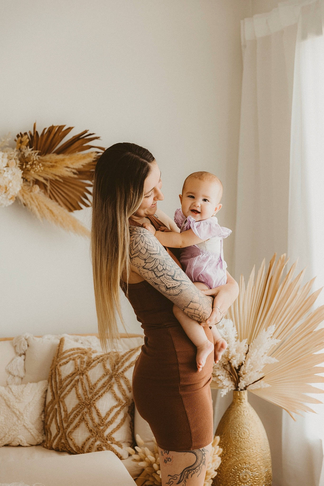 Haizel is registered to the contest to win money with this photo: arm, baby, blond, child, comfort, couch, curtain, event, fashion_design, feather, flash_photography, fun, furniture, happy, headpiece, human_leg, person, picture_frame, sitting, thigh