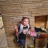 Ma'Kinzie joined the competition — help win amazing prizes! child, girl, smiling, portrait, peace_sign, backpack, braids, hair_accessories, casual_clothing, black_shirt, leggings, sneakers, pink_bag, brick_fireplace, fireplace, indoor, wood_floor, shoes, clothes, posing
