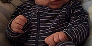 Kingston joined the competition — help win amazing prizes! baby, newborn, infant, child, blanket, onesie, striped_clothing, hands, face, expression, scrunched_face, hair, indoors, bedding, cozy, portrait, close_up, soft_texture, sleepy, cute