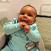 Akari joined the competition — help win amazing prizes! baby, child, smiling, happy, clothing, onesie, disney_pixar, indoor, furniture, high_chair, person, infant, cute, portrait, sitting, hands, face, head, expression, room