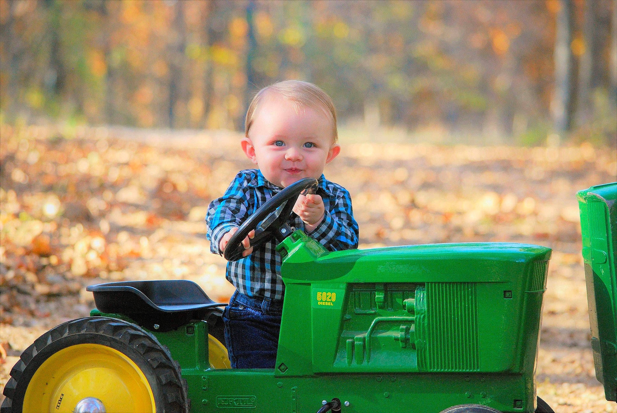 Lawrence joined the competition — help win amazing prizes! agricultural_machinery, child, farm, fun, grass, green, lawn, person, plant, play, toddler, tractor, tree, vehicle