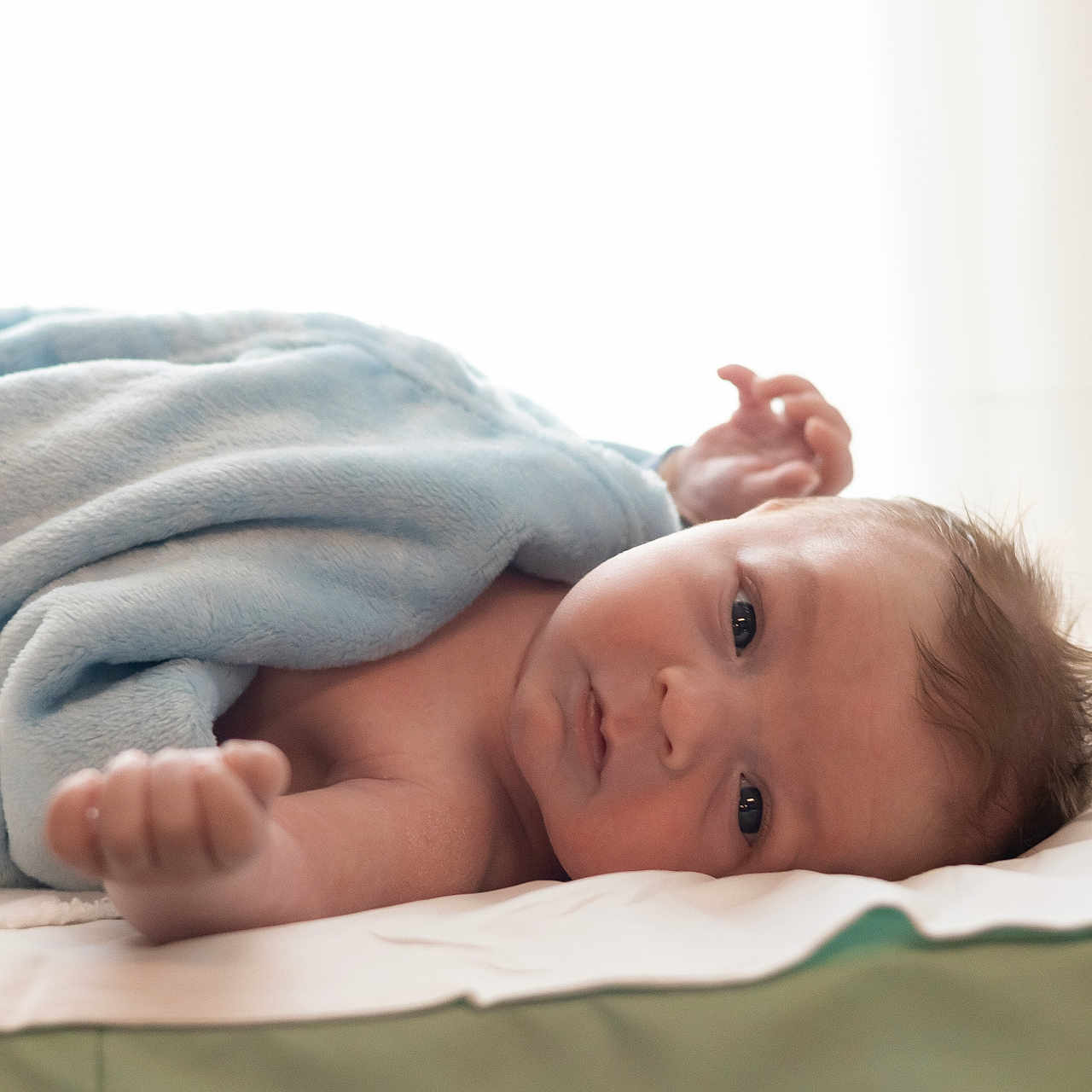 Jaemis is registered to the contest to win money with this photo: architecture, baby, bed, blanket, bodypart, building, crib, face, finger, furniture, hand, happy, head, hospital, newborn, person, photography, portrait, smile, towel