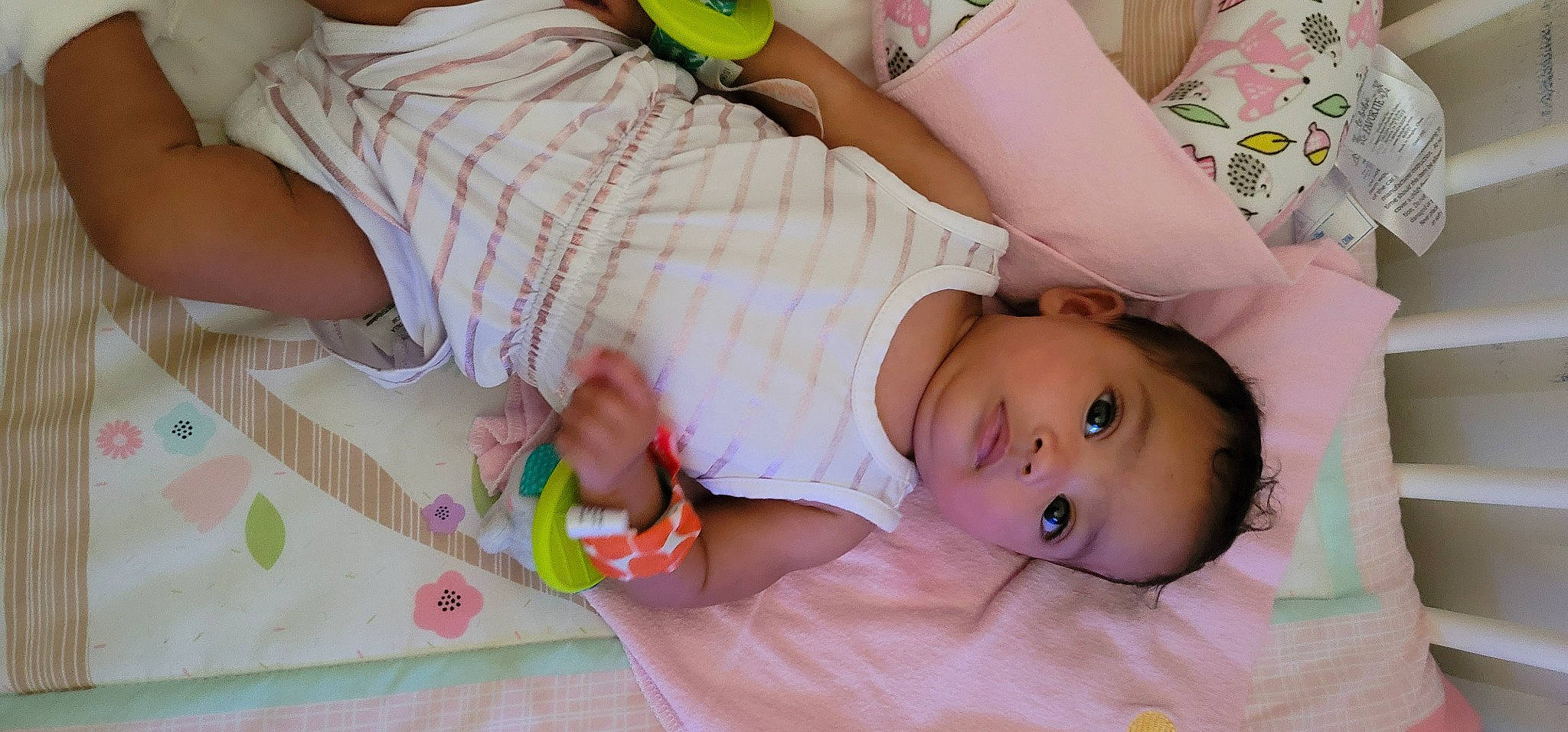 Naomi joined the competition — help win amazing prizes! arm, baby, baby_toddler_clothing, cheek, child, comfort, facial_expression, finger, green, hand, happy, nail, pattern, person, pink, product, skin, textile, toddler, white