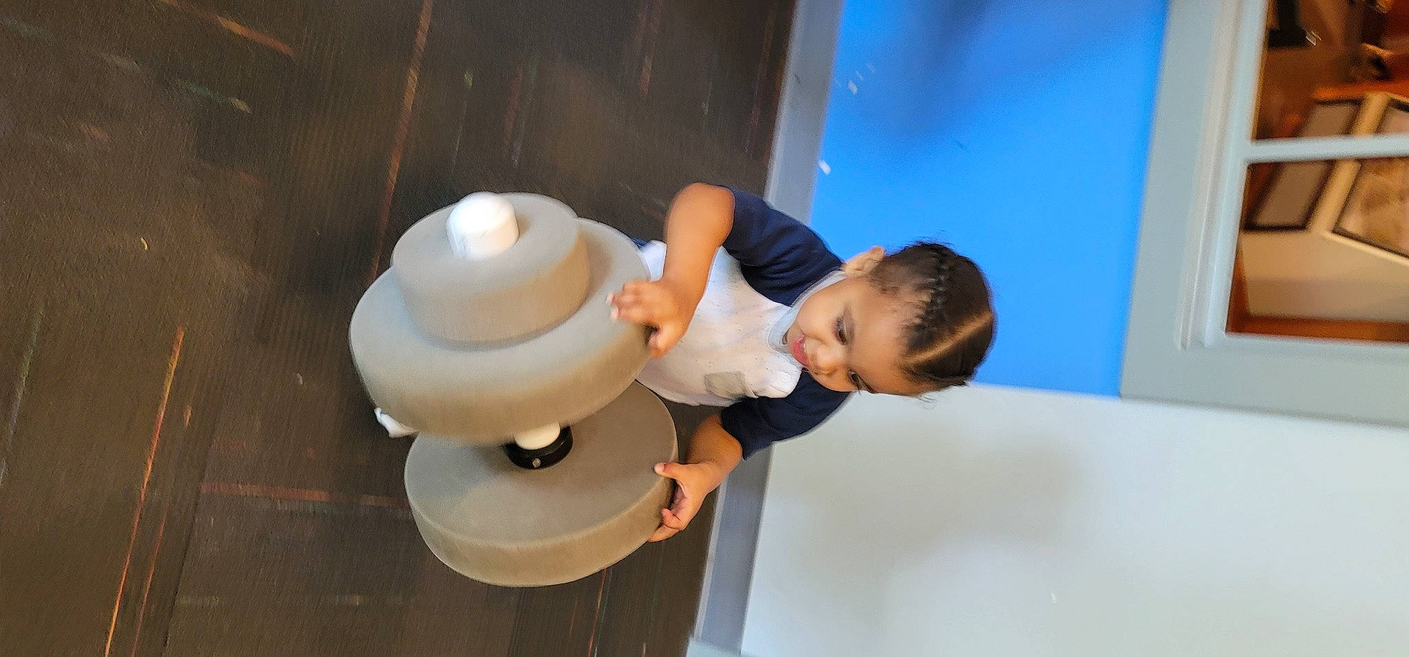King is registered to the contest to win money with this photo: ceramic, child, elbow, fashion_accessory, flooring, fun, gesture, happy, machine, neck, person, room, sleeve, sun_hat, t_shirt, thumb, toddler, wrist