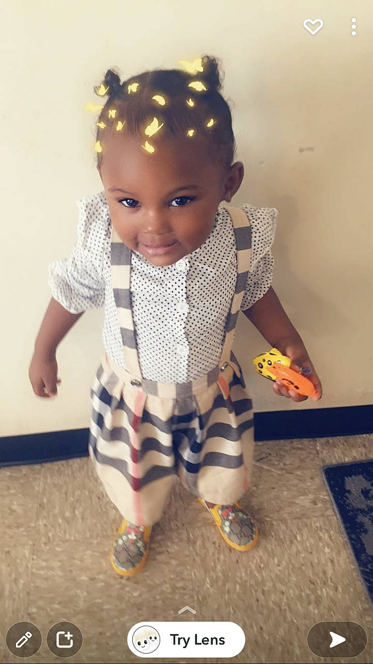 Kaliah joined the competition — help win amazing prizes! arm, baby_toddler_clothing, black_hair, clothing, doll, fashion_design, fawn, flooring, hair, head, joint, neck, outerwear, pattern, person, plaid, sleeve, t_shirt, toddler, toy