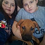 Rocko is registered to the contest to win money with this photo: child, children, indoor, puppy, dog, face_paint, couch, casual, portrait, smile, brown_dog, sitting, holding, family, cute, young, candid, relaxed, home, fun