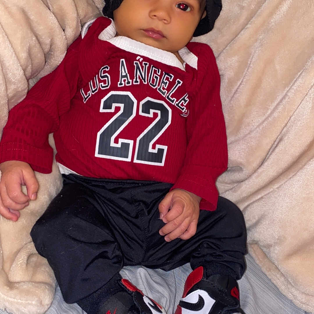 Armoni joined the competition — help win amazing prizes! baby, bodypart, bonnet, cap, clothing, couch, face, finger, footwear, furniture, hat, head, knitwear, pants, person, photography, portrait, shoe, sneaker, sweater