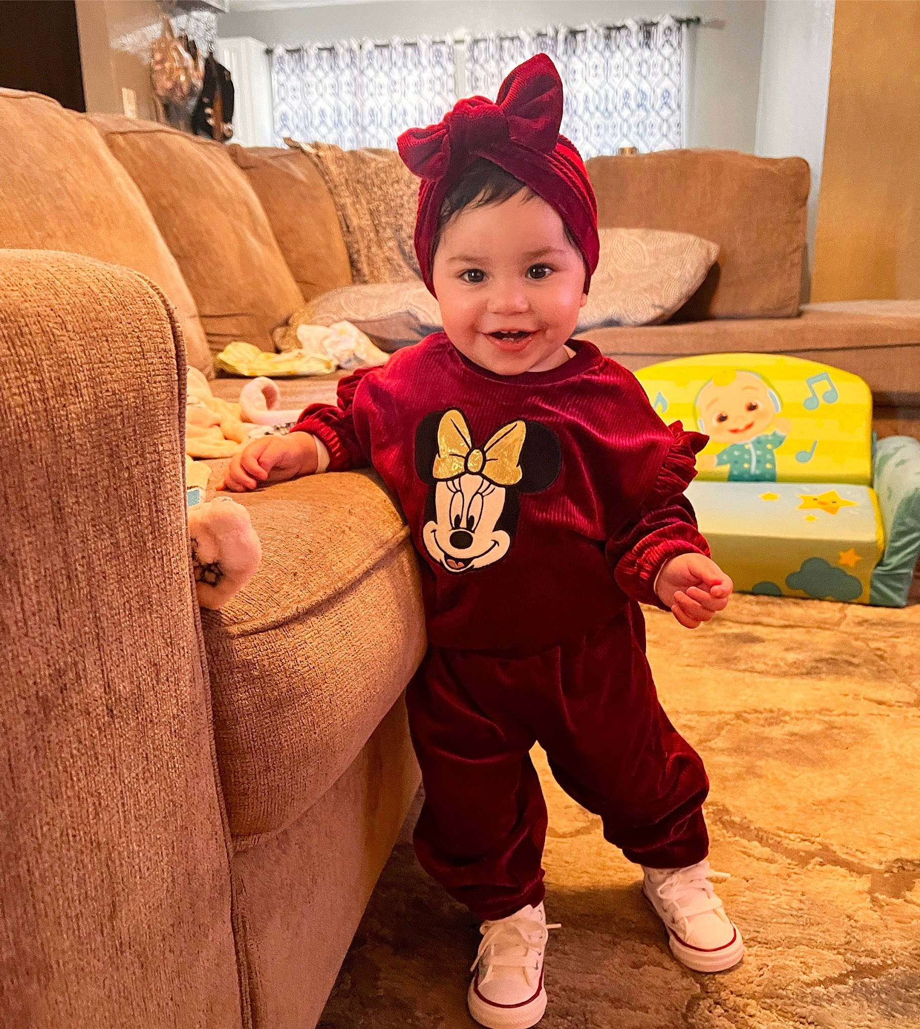 Jazelle joined the competition — help win amazing prizes! baby_toddler_clothing, child, comfort, couch, fictional_character, floor, flooring, fun, happy, hat, headwear, joy, living_room, orange, pajamas, person, room, shoe, sitting, sleeve