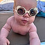 baby, child, sunglasses, reflection, pool, outdoor, lounge_chair, cute, summer, skin, person, sunshine, bare_chest, hand, infant, fun, relaxation, daytime, fashion, accessory