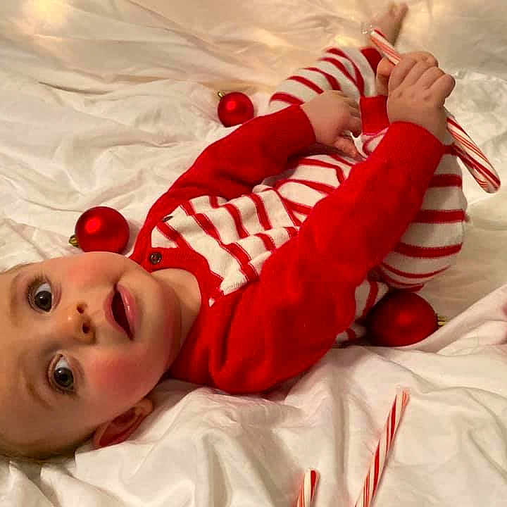 Heath is registered to the contest to win money with this photo: baby, child, christmas, christmas_eve, fictional_character, holiday, leg, red, santa_claus, toddler
