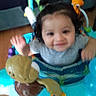Kingstin joined the competition — help win amazing prizes! toddler, child, baby, activity_center, toy, smiling, indoor, person, curly_hair, waving, playful, colorful, seat, plastic, happy, young_child, infant, clothing, face, cute