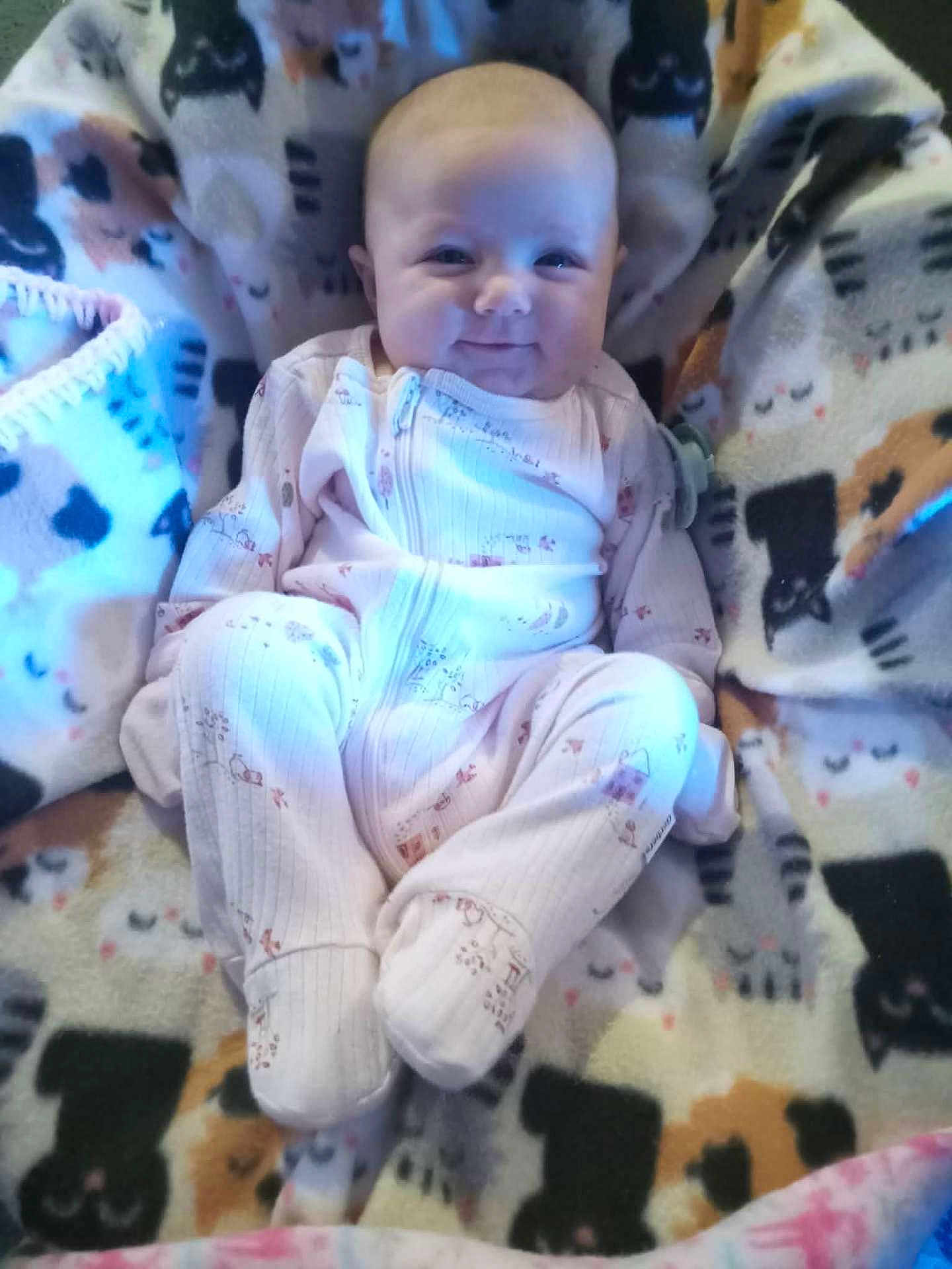 Margaret Hamilton joined the competition — help win amazing prizes! baby, blanket, cat_pattern, child, clothing, comfort, cozy, cute, face, happy, indoor, infant, onesie, pattern, portrait, sitting, smile, soft, warm, young