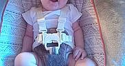 Margaret Hamilton is registered to the contest to win money with this photo: baby, baby_seat, buckle, candid, carpet, chair, child, cute, face, foot, furniture, harness, indoor, infant, legs, onesie, patterned_fabric, plush, portrait, smile