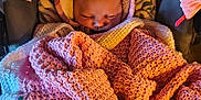 Margaret Hamilton is registered to the contest to win money with this photo: baby, sleeping, blanket, crocheted_blanket, hood, baby_carrier, floral_pattern, pink, cream, cozy, infant, sleep, soft, cushion, indoor, child, wrapped, warm, peaceful, young