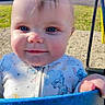 baby, child, smiling, blue_eyes, onesie, swing, playground, outdoor, sunlight, grass, hand, face, closeup, cute, infant, person, daytime, happy, park, clothing