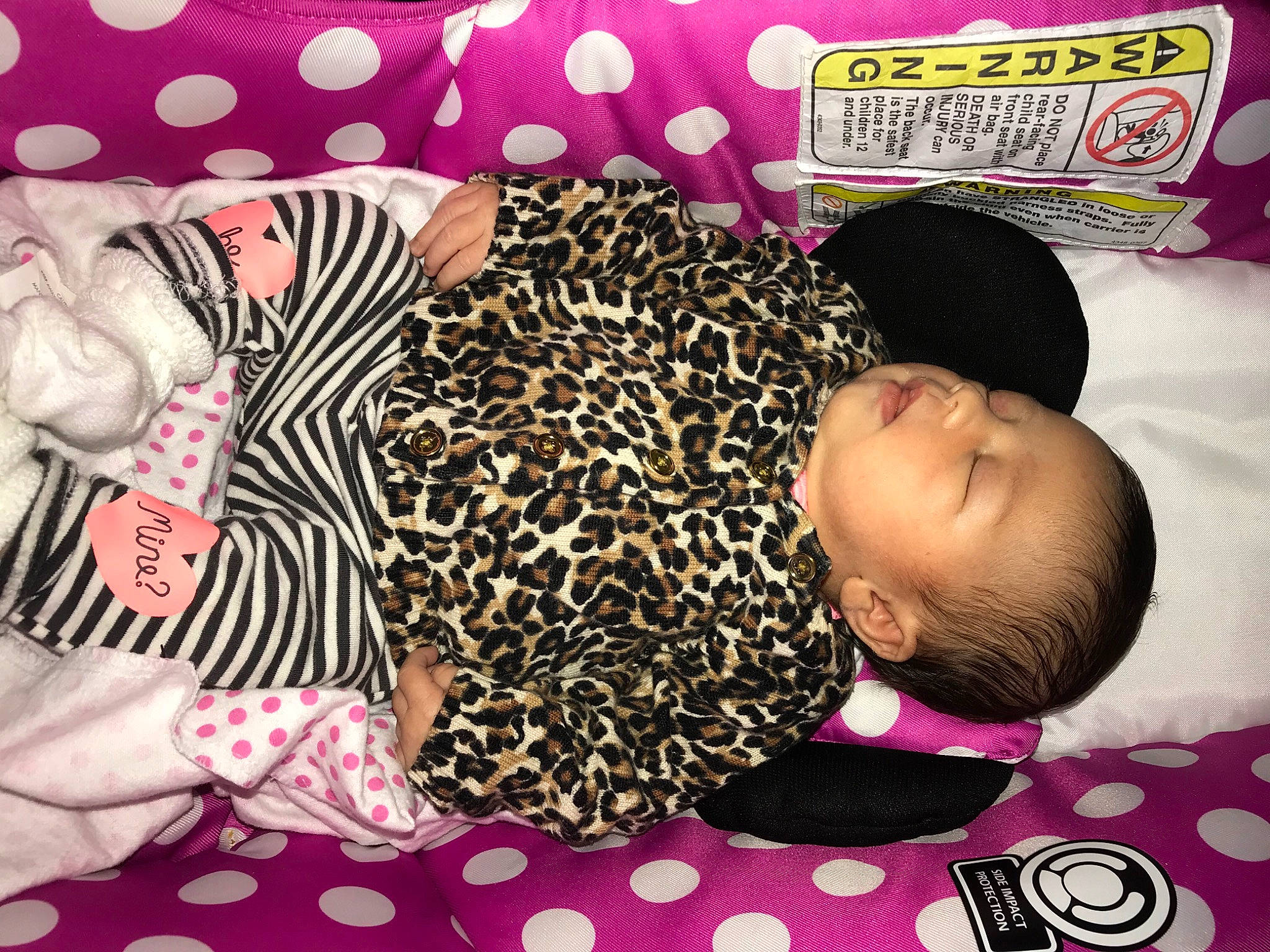 Emerie is registered to the contest to win money with this photo: baby, baby_products, baby_toddler_clothing, bean_bag, black_hair, car_seat, child, ear, furniture, hair, hairstyle, nap, outerwear, pattern, person, pink, product, sleep, textile, toddler