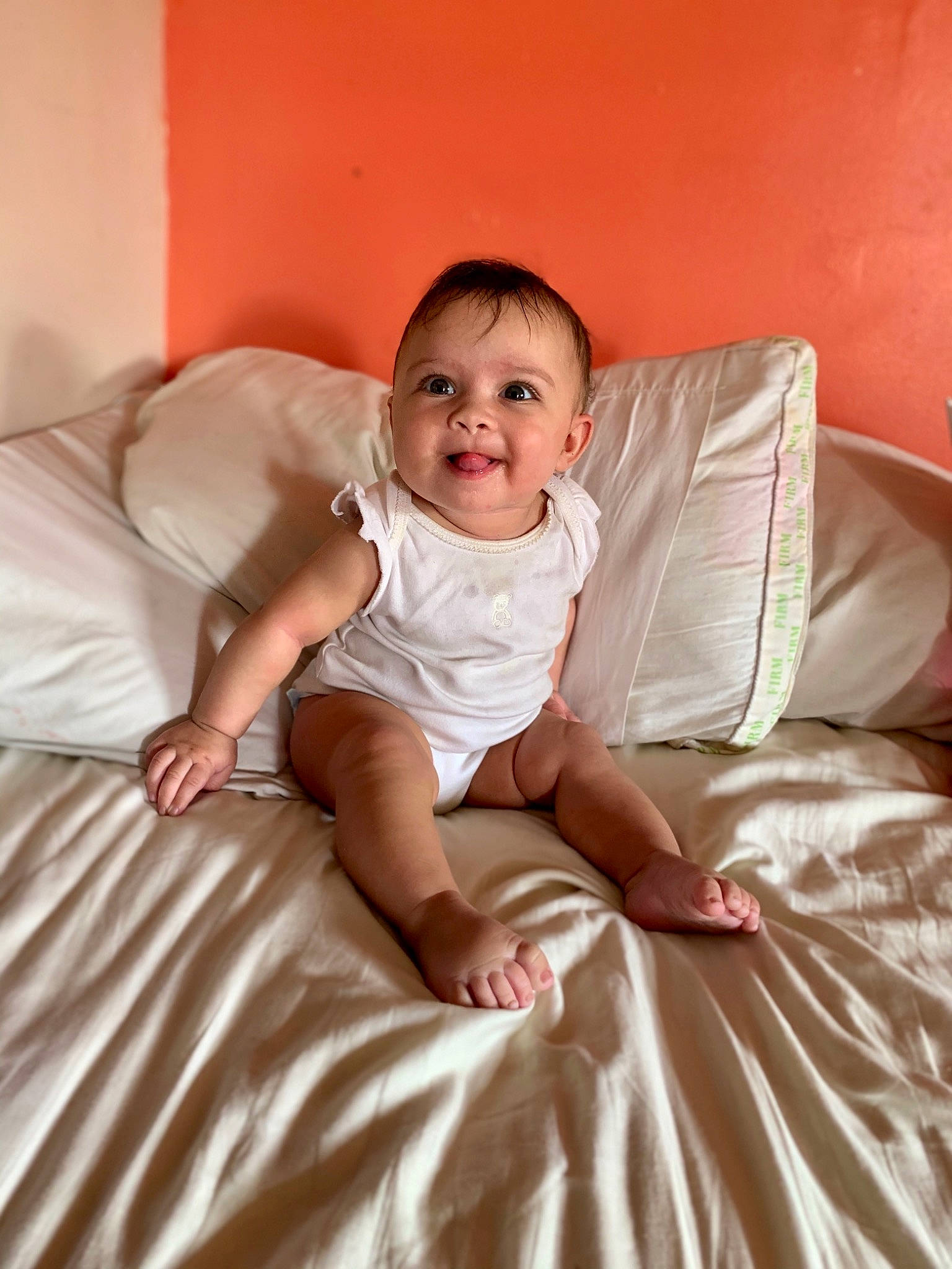 Emerie is registered to the contest to win money with this photo: baby, baby_toddler_clothing, child, comfort, facial_expression, finger, flash_photography, floor, flooring, fun, hairstyle, happy, human_leg, person, pink, shoulder, sitting, skin, smile, toddler