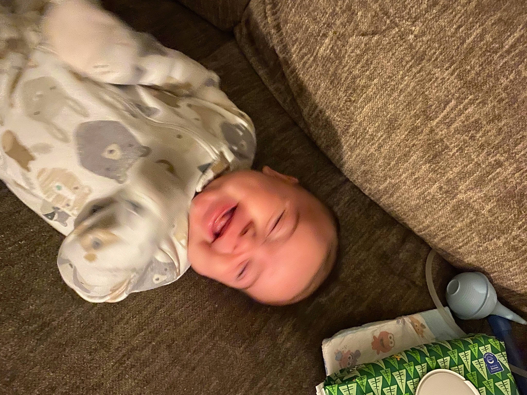 Luis is registered to the contest to win money with this photo: baby, baby_toddler_clothing, banknote, bedtime, cheek, child, comfort, cup, drinkware, flooring, grass, linens, person, room, sitting, sleeve, smile, tableware, textile, toddler