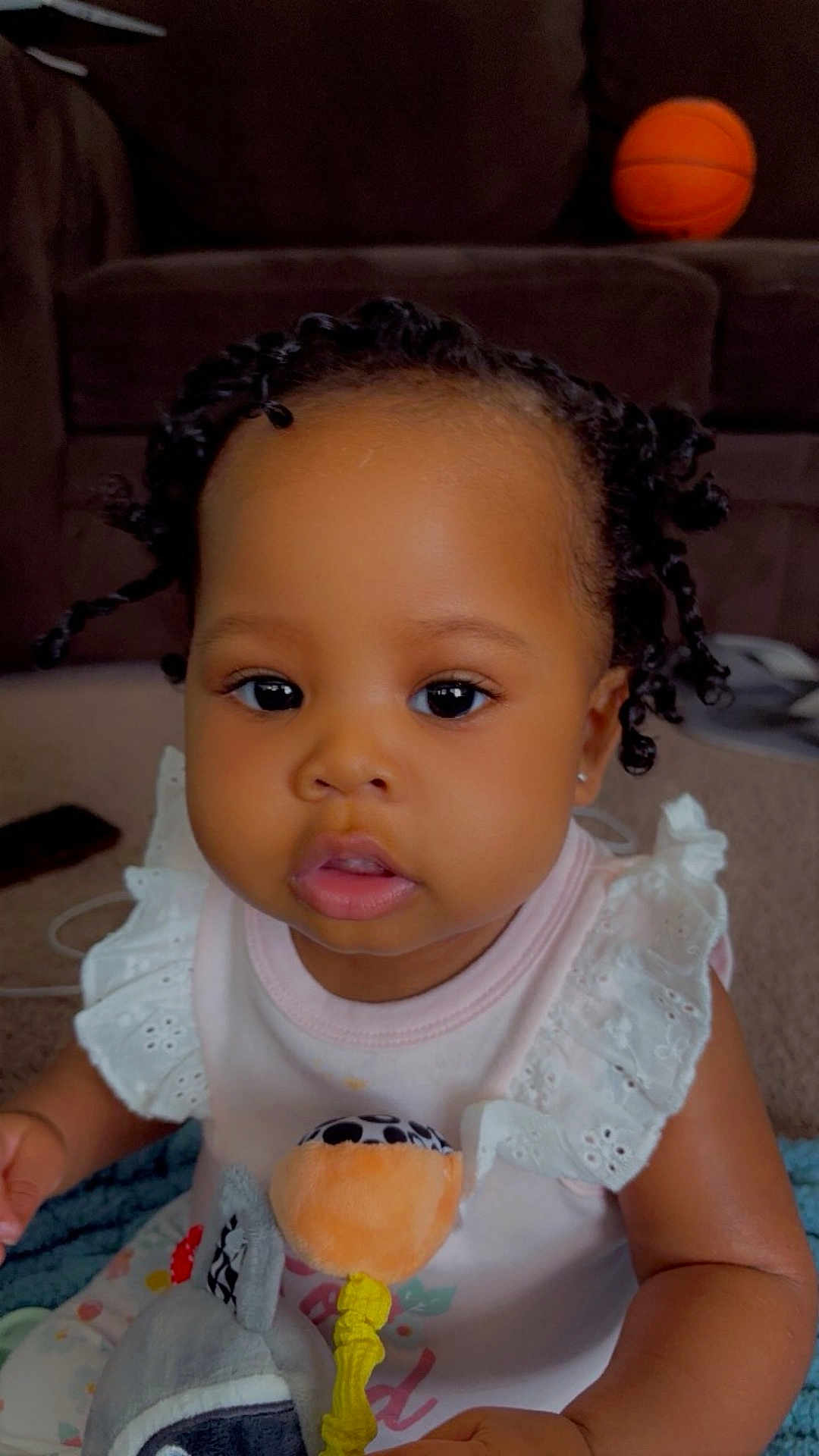 Tazara is registered to the contest to win money with this photo: baby, ball, basketball, basketballball, couch, cream, cushion, cutlery, dessert, face, food, furniture, head, icecream, icing, person, photography, portrait, sitting, sport
