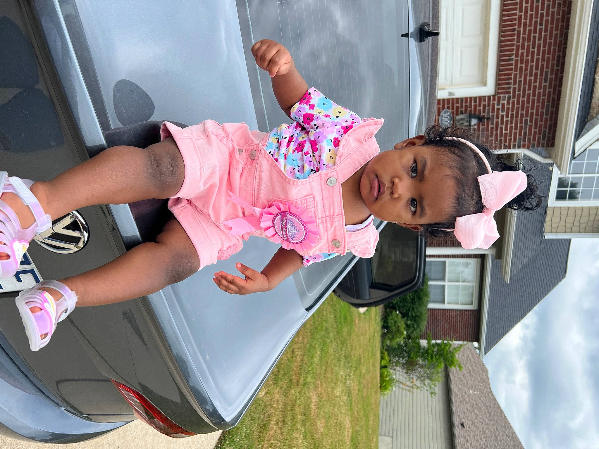 Chloe is registered to the contest to win money with this photo: automotive_design, automotive_exterior, baby, car, child, family_car, fashion, fun, hat, human_leg, leisure, motor_vehicle, person, pink, sandal, shorts, thigh, toddler, vehicle, vehicle_door