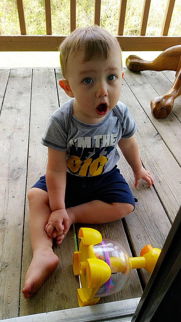 Leyton is registered to the contest to win money with this photo: baby, child, leg, person, play, surprise, toddler, yellow