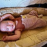 Malakai is registered to the contest to win money with this photo: baby, sleeping, bassinet, cozy, padded, clothing, infant, cute, soft, resting, child, peaceful, indoors, fabric, texture, warm, comfortable, small, person, relaxing