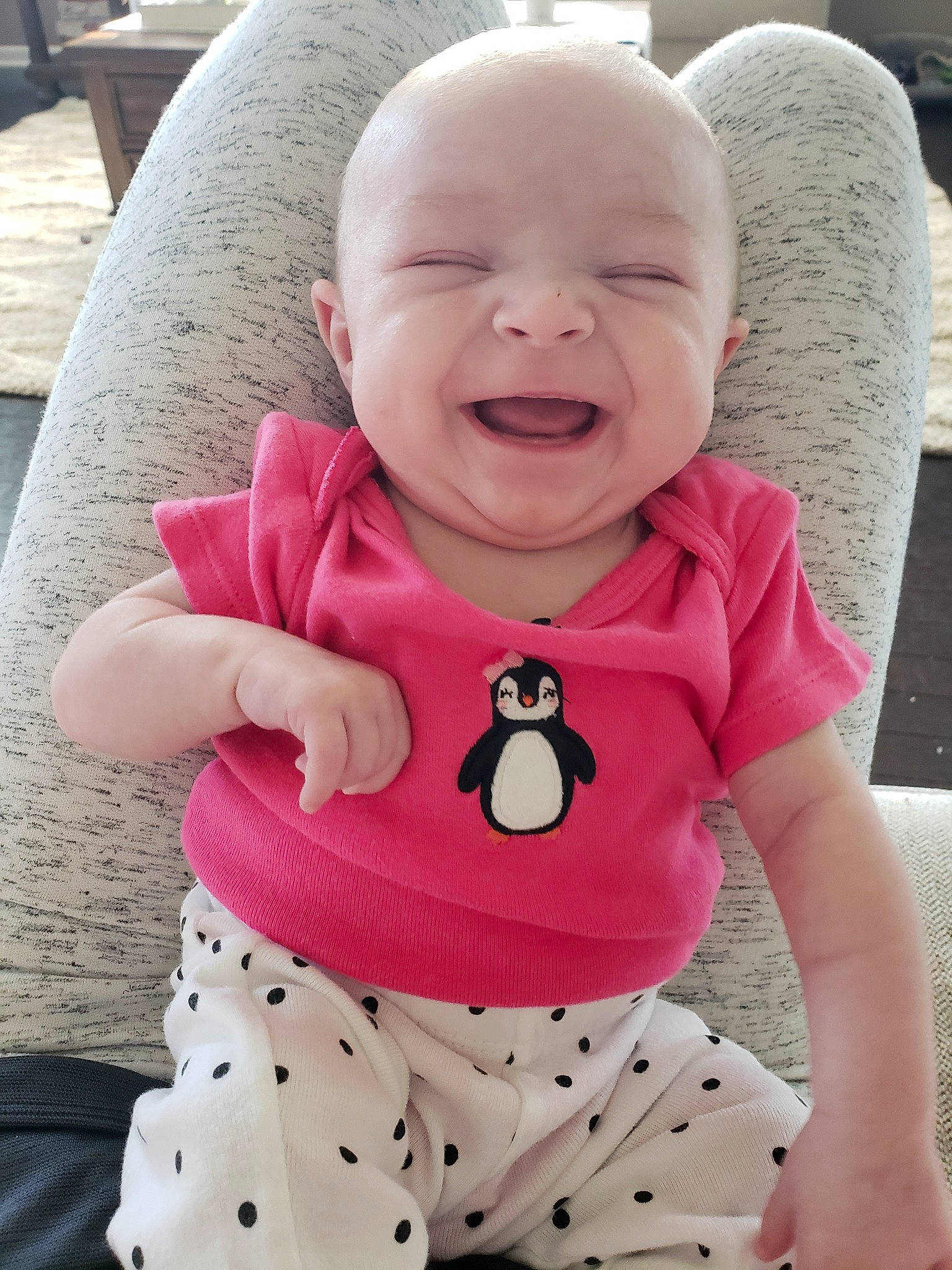 Lindsey is registered to the contest to win money with this photo: baby, baby_laughing, baby_products, baby_toddler_clothing, cheek, child, design, face, facial_expression, head, lip, neck, pattern, person, pink, polka_dot, product, skin, sleeve, smile