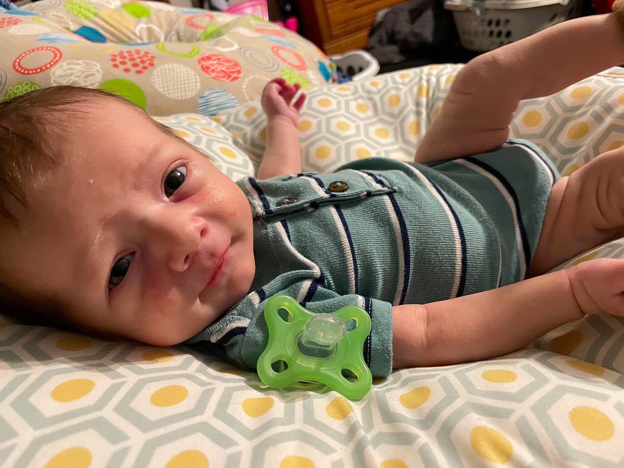 Jak is registered to the contest to win money with this photo: baby, baby_products, baby_toddler_clothing, cheek, child, comfort, finger, fun, grass, happy, head, linens, mouth, pattern, person, sitting, skin, sleeve, smile, toddler