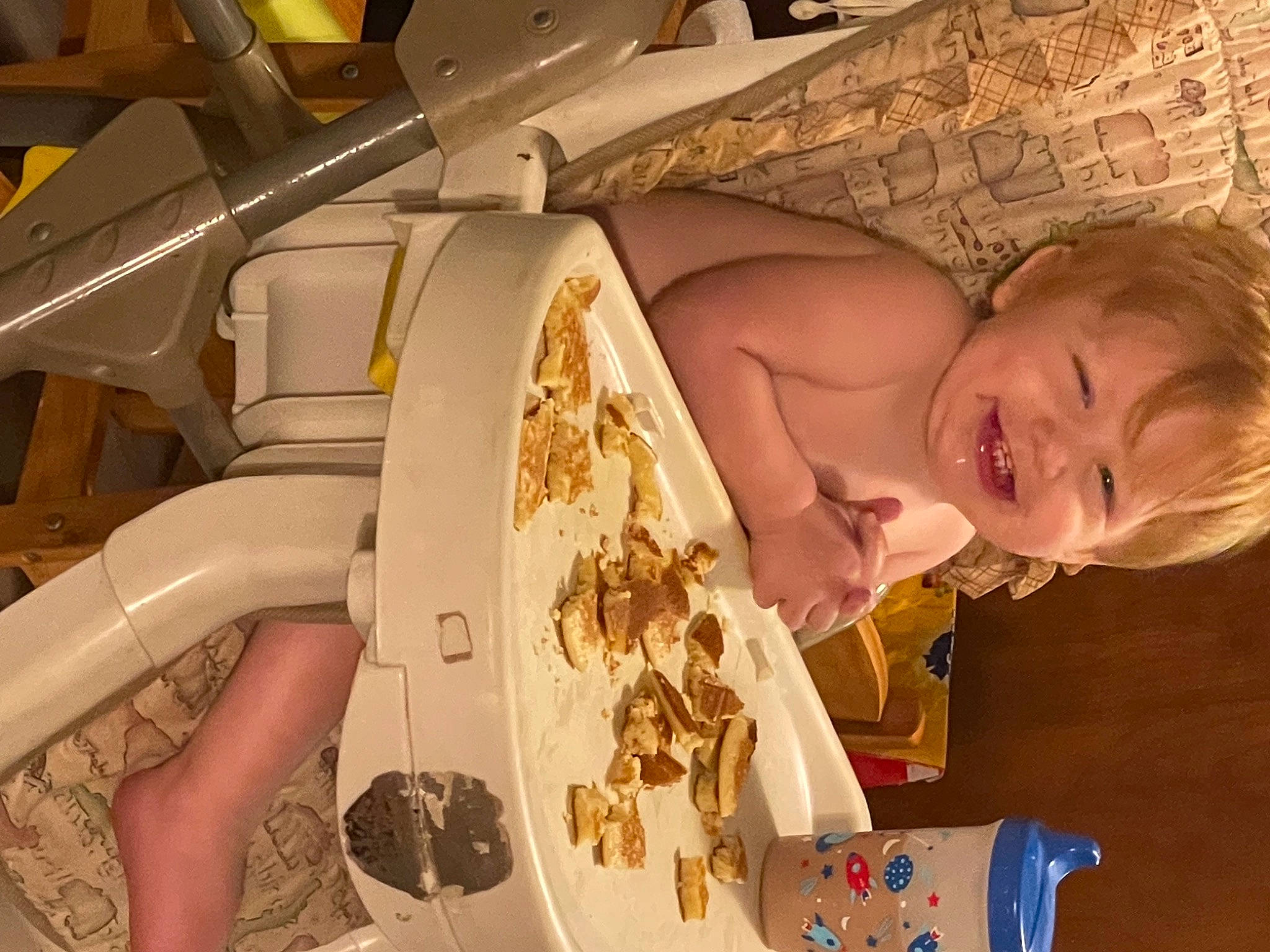 John is registered to the contest to win money with this photo: arm, baby, child, comfort, comfort_food, cuisine, dessert, dish, food, fun, head, human_body, ingredient, joy, machine, nail, organ, person, room, smile