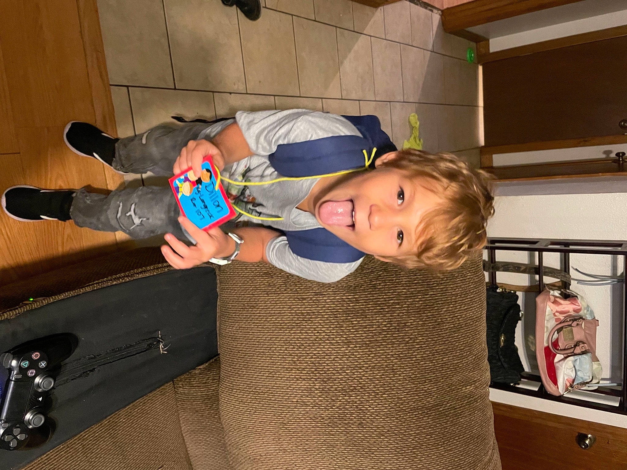 Dillon joined the competition — help win amazing prizes! baby, baby_products, baby_toddler_clothing, bag, child, comfort, electric_blue, flooring, fun, hardwood, luggage_and_bags, mammal, person, room, sitting, t_shirt, toddler